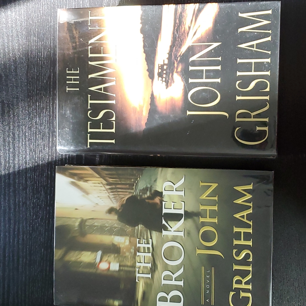 2 first edition John Grisham novels. The Testament is signed.